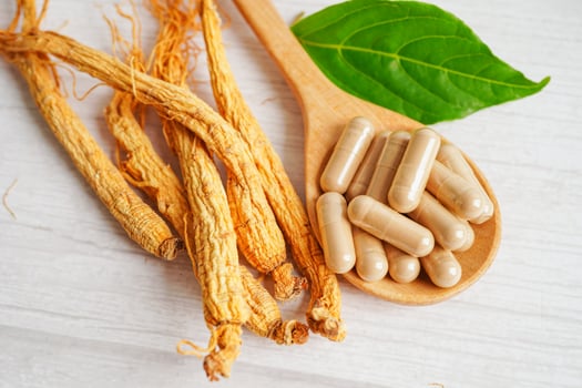 Ginseng roots and green leaf, healthy food. photo