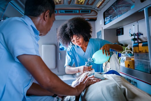 Team of paramedic is helping the senior patient who is stop breathing from car crash by using respirator for heart attack and street accident concept photo