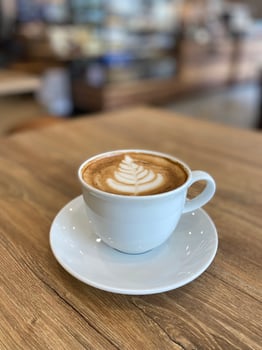 Hot coffee cup on table photo