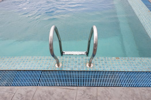 Papua, Indonesia - October 10, 2021. People swimming in the pool near the sea photo