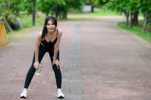 Slim girl play yoga on the lawn at the park,relax in nuture,Asian Girls love health practicing yoga photo