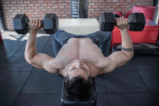 Portrait of asian man big muscle at the gym,Thailand people,Workout for good healthy,Body weight training,Fitness at the gym concept photo