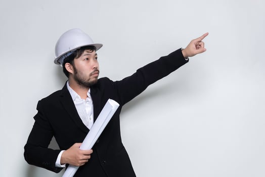Handsome asian Engineer man Wear a suit,Wearing a helmet on white background,Thailand people photo