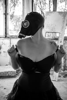 Woman with gas mask and a dress photo