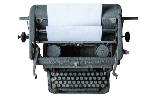 old vintage dust-covered typewriter with sheet of paper isolated on white background photo