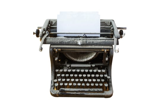 old vintage dust-covered typewriter with sheet of paper isolated on white background photo
