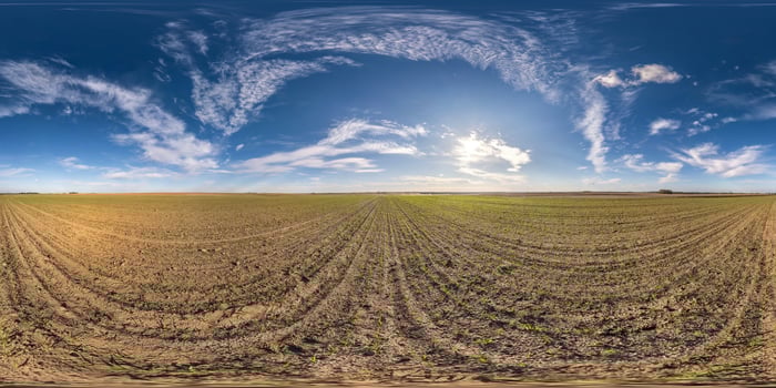 full seamless spherical hdri panorama 360 degrees angle view among fields in spring day with awesome clouds in equirectangular projection, ready for VR AR virtual reality content photo