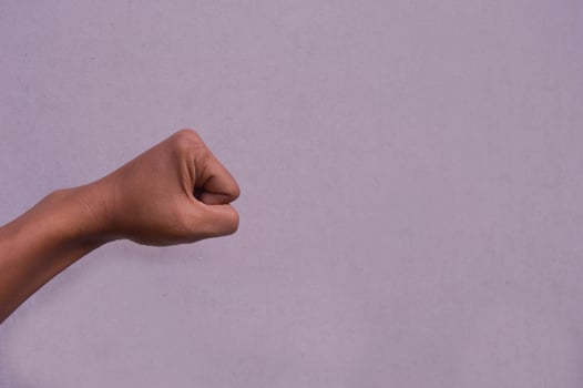 fist clenched against a white background photo