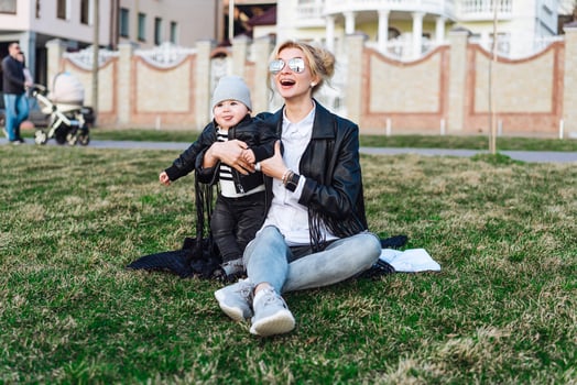 Young girl and child on green gras photo
