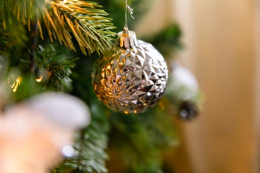 Classic Christmas decorated New year tree. Christmas tree with wite and silver decorations, ornaments toy and ball. Modern classical style interior design apartment. Christmas eve at home. photo