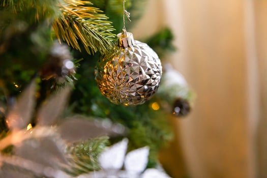 Classic Christmas decorated New year tree. Christmas tree with wite and silver decorations, ornaments toy and ball. Modern classical style interior design apartment. Christmas eve at home. photo