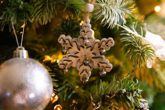 Classic Christmas decorated New year tree. Christmas tree with wite and silver decorations, ornaments toy and ball. Modern classical style interior design apartment. Christmas eve at home. photo