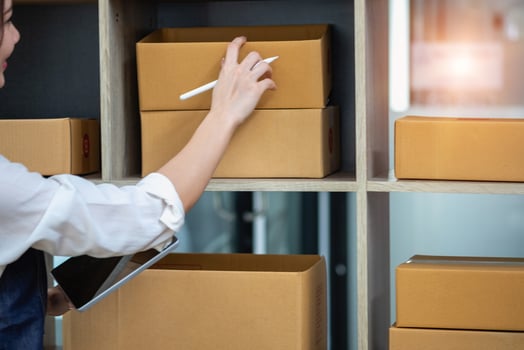 Businesswoman checking online for delivery to customers. photo