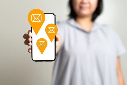 Woman hand holding mobile phone receive or send email icon photo