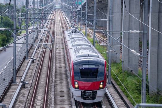 The electric train drives at high speed motion from the station with passenger and cargo to station destination is modern trasportation concept with sun light sky background. photo