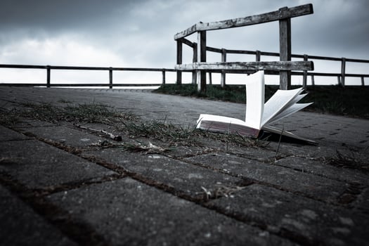 open book on a walkway photo