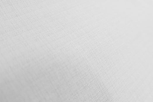 The texture of the old white fabric has a vintage dullness, there is a text area for the background, used for vintage wallpapers and designs. photo
