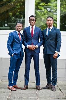 Three african american happy successful mans at suit. photo