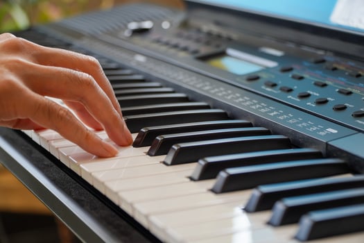 male hands playing the piano .Human hands playing the piano on the party . Man playing the synthesizer keyboard photo