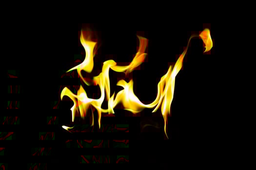 Fire flame texture. Burning material backdrop. Burn effect pattern. Blaze and torch wallpaper. Heat and haze backdrop. photo