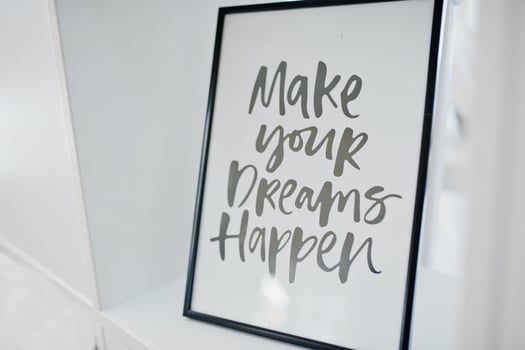 Framed picture with motivational saying on it on light background. photo