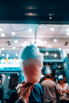 hand holding cotton candy photo