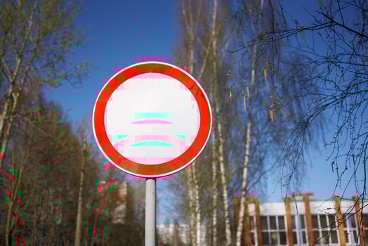 Traffic sign Movement prohibited against the background of the school building. photo