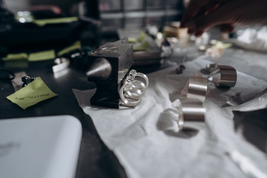Different jewelery on the table from the jeweler from a close angle photo