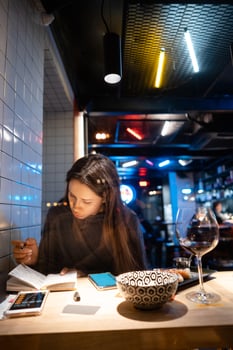 Woman works at a cafe in the evening photo