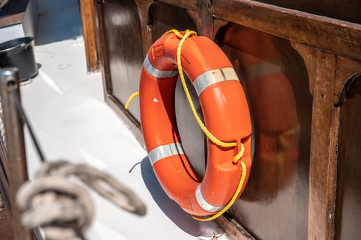 One orange lifebuoys on board the ship. photo