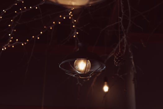 Lamp hanging outside on a dark background. photo