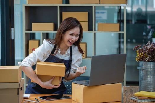 Young businesswoman checking orders and showing goodwill in ordering online from customers. photo