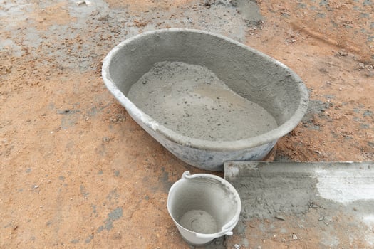Plastic cement mixer on the soil. with plastic cement cane on the side bed. photo