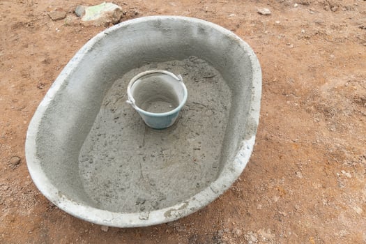 Plastic cement mixer on the soil. with plastic cement tank placed placed inside. photo