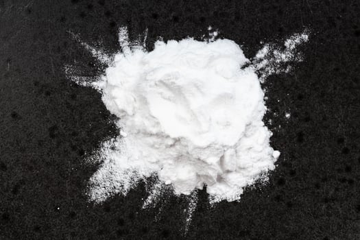 top view of pile of potato starch closeup on black photo