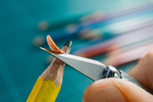 Hand use art knife sharpening blunt yellow pencil photo
