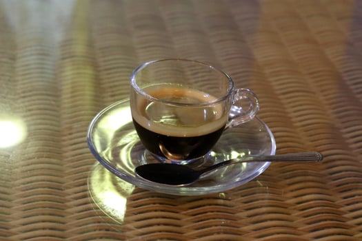 On the table in the restaurant strong and hot coffee. photo