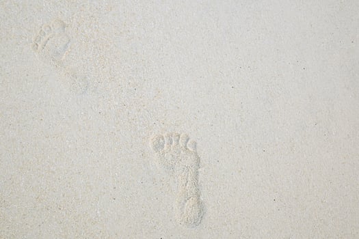 Footprints on the beach photo