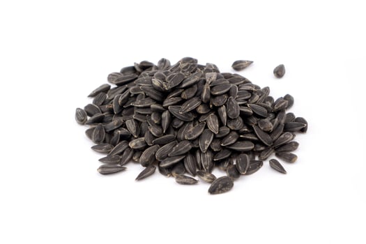 black sunflower seeds on white background photo