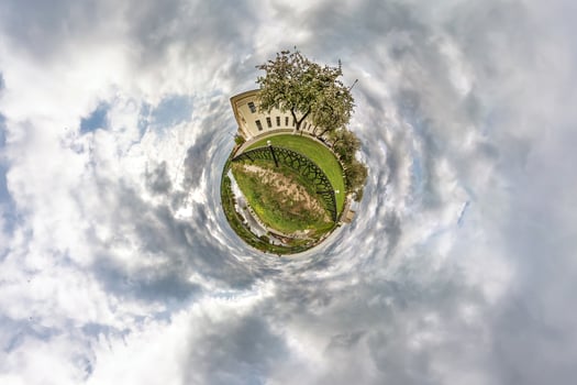Little planet transformation of spherical panorama 360 degrees. Spherical abstract aerial view in field in nice evening with awesome beautiful clouds. Curvature of space. photo