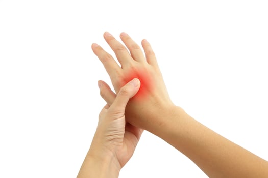 Young woman hand pain with red alert accent isolated on white background photo