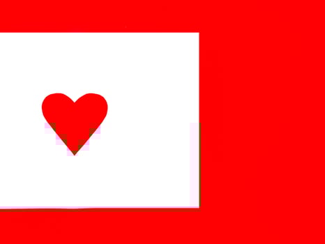 White paper perforated into a heart shape. Placed on a red background photo