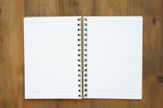 blank notebook on wooden table, business concept photo