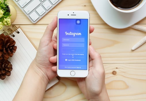BANGKOK,THAILAND, JULY 26 2016 Woman hand holding Apple iPhone 6s with Instagram application on the screen  Instagram is a photo sharing app for smartphones.