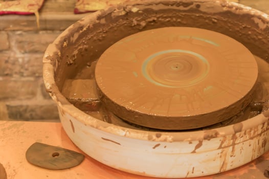 close up of dirty pottery wheel after work photo