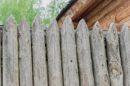 old peeled wooden fence close up photo