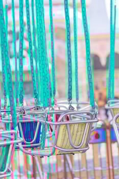 empty seats of childrens carousel in amusement park photo