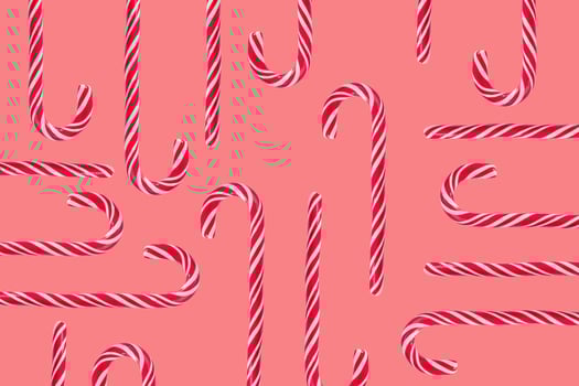 Traditional  candy canes on pink background. New Year and Christmas concept photo