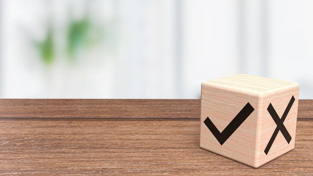 The right and wrong symbol on wood cube 3d rendering photo