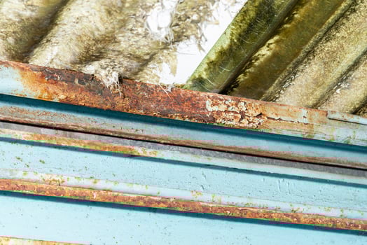 Rain water leaks on the roof causing rusty iron. Home renovation concept. photo